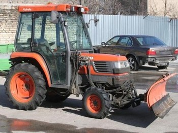 Kubota ST30 with brush and blade - Tractor