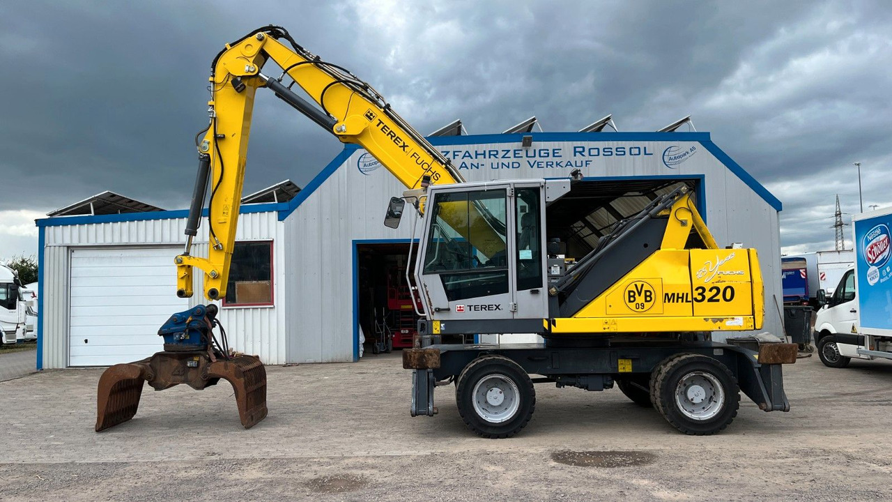 Fuchs TeRex MHL 320 D Umschlagbagger Greifer Pratzen - Manipulador de materiales: foto 1 Fuchs TeRex MHL 320 D Umschlagbagger Greifer Pratzen - Manipulador de materiales: foto 1