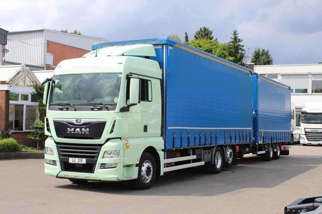 MAN TGX 26.460 Retarder Jumbo-Zug 120M3 Durchlade - Camión lona: foto 1 MAN TGX 26.460 Retarder Jumbo-Zug 120M3 Durchlade - Camión lona: foto 1