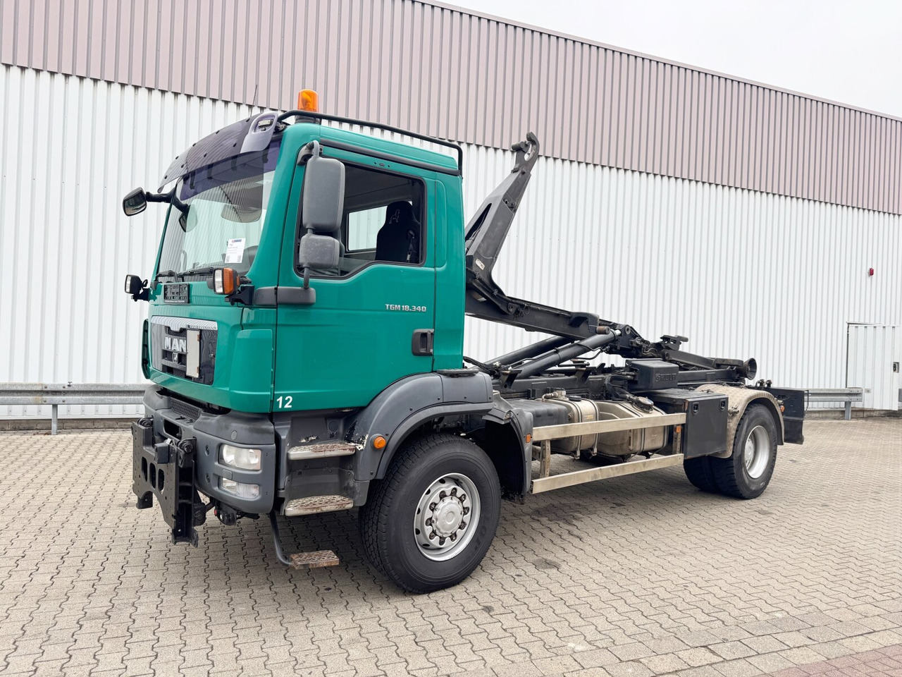 MAN TGM 18.340 4x4 BB TGM 18.340 4x4 BB, Hiab LHT 19046 Abrollkipper, Widi Platte - Camión multibasculante: foto 1 MAN TGM 18.340 4x4 BB TGM 18.340 4x4 BB, Hiab LHT 19046 Abrollkipper, Widi Platte - Camión multibasculante: foto 1