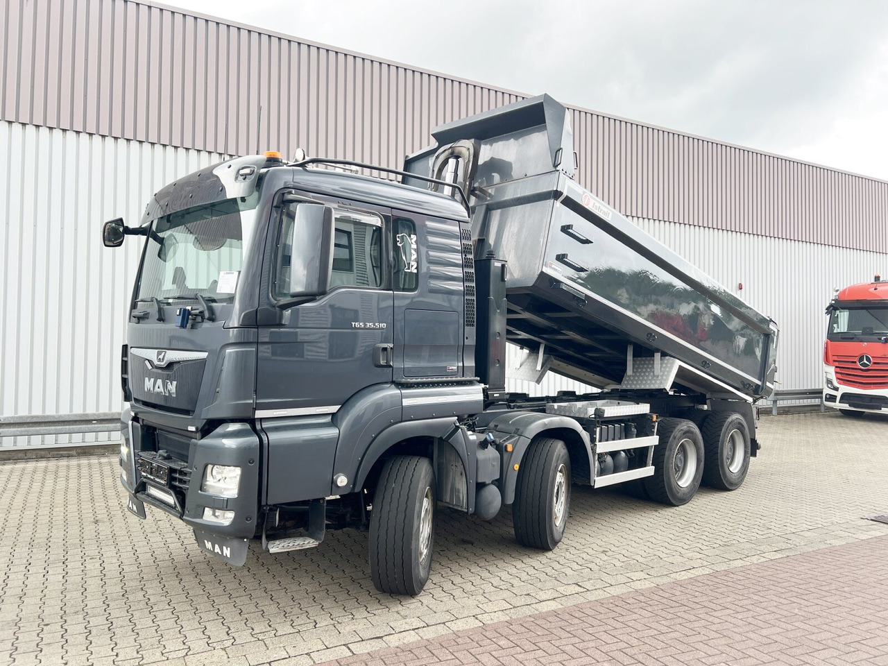 MAN TGS 35.510 8x4 BL TGS 35.510 8x4 BL, Intarder, Stahlmulde ca. 13m³, hydr. Heckklappenöffnung - Dúmper: foto 1 MAN TGS 35.510 8x4 BL TGS 35.510 8x4 BL, Intarder, Stahlmulde ca. 13m³, hydr. Heckklappenöffnung - Dúmper: foto 1
