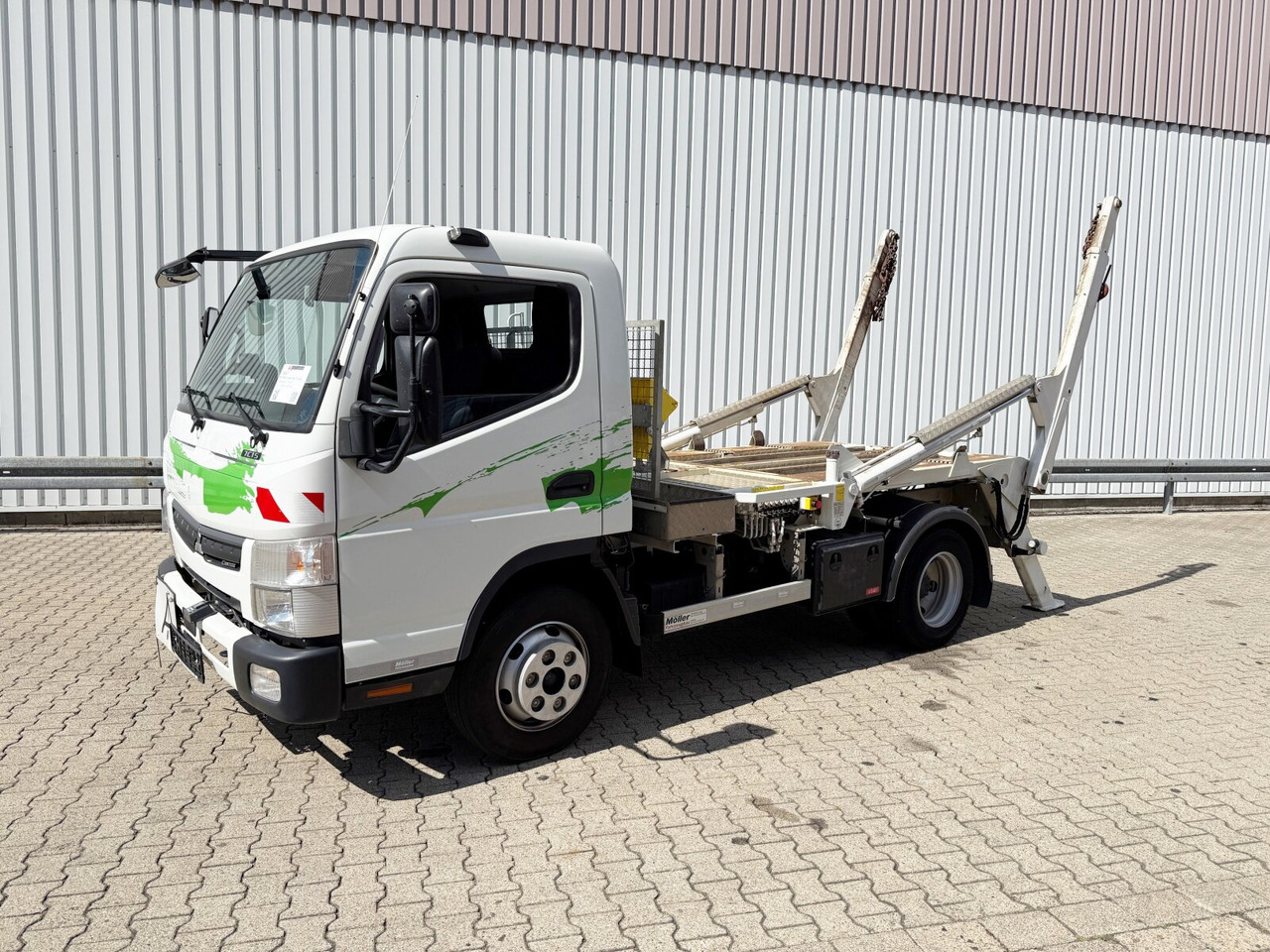 Mitsubishi Canter Fuso 7C15 4x2 Canter Fuso 7C15 4x2, Tele-Absetzer, Vereiterbar bis 10m³ - Camión portacontenedor de cadenas: foto 1 Mitsubishi Canter Fuso 7C15 4x2 Canter Fuso 7C15 4x2, Tele-Absetzer, Vereiterbar bis 10m³ - Camión portacontenedor de cadenas: foto 1
