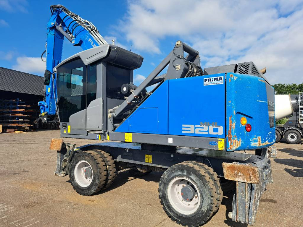Fuchs MHL320F - Manipulador de materiales: foto 1 Fuchs MHL320F - Manipulador de materiales: foto 1