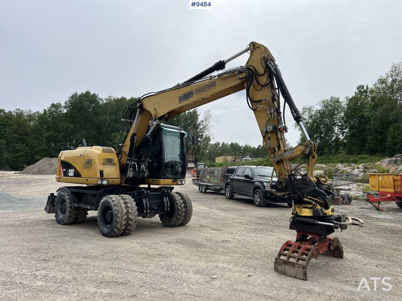 CAT M313D with tipping wagon and attachments (VIDEO) - Excavadora de ruedas: foto 1 CAT M313D with tipping wagon and attachments (VIDEO) - Excavadora de ruedas: foto 1