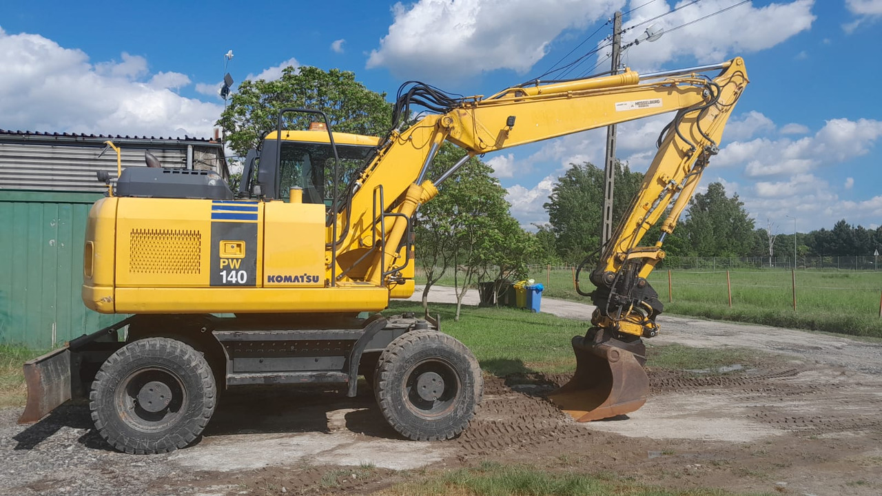 KOMATSU PW 140-7 - Excavadora de ruedas: foto 1 KOMATSU PW 140-7 - Excavadora de ruedas: foto 1