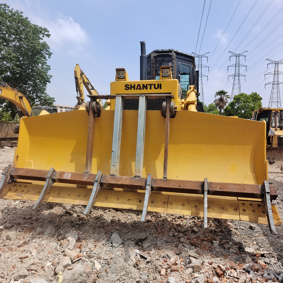 SHANTUI SD22 SD32 with Weeding Rake / Root Rake Attachment for Land Clearing, Forestry, and Construction - Bulldozer: foto 1 SHANTUI SD22 SD32 with Weeding Rake / Root Rake Attachment for Land Clearing, Forestry, and Construction - Bulldozer: foto 1