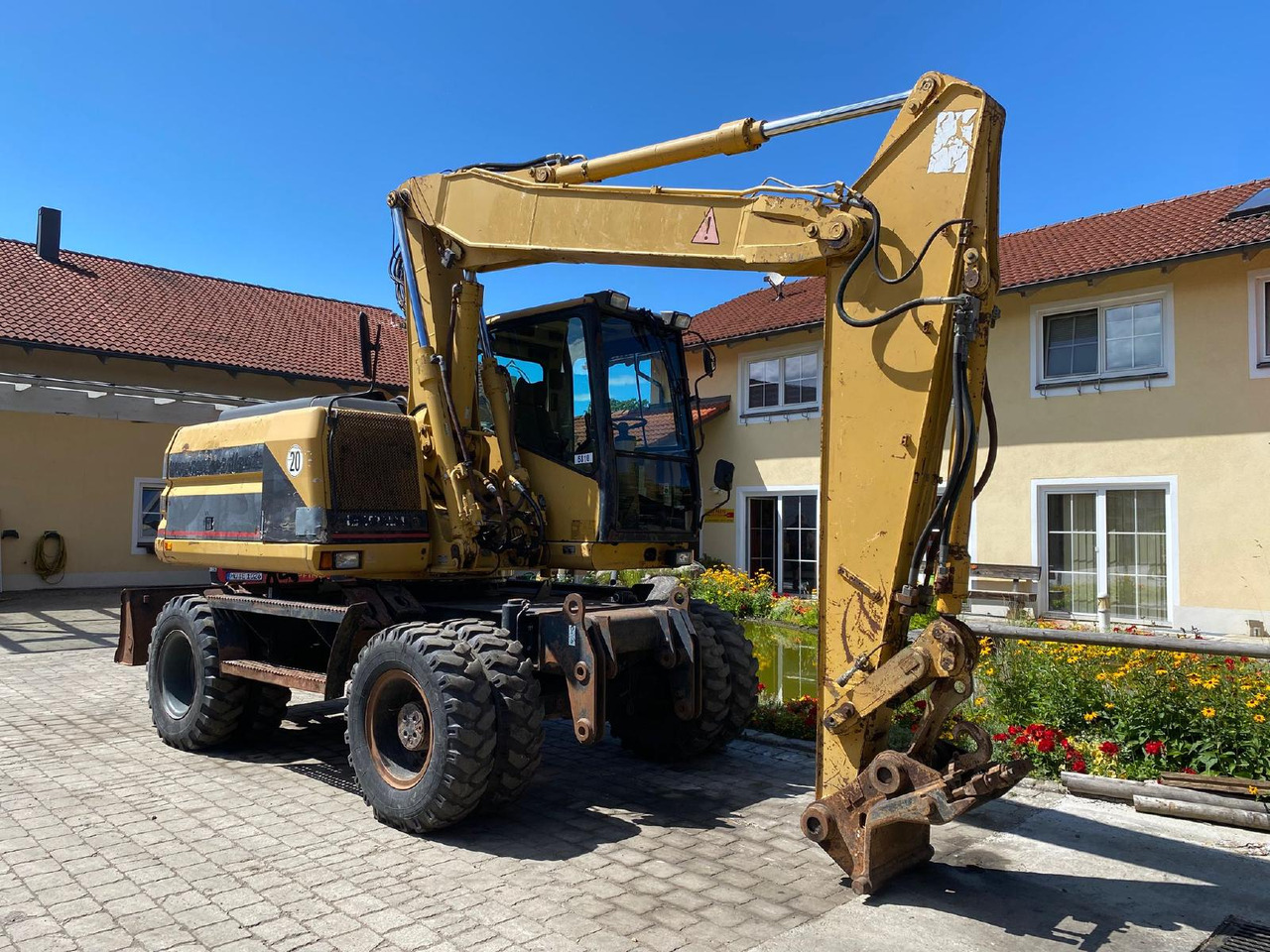 Caterpillar M 312 - Excavadora de ruedas: foto 1 Caterpillar M 312 - Excavadora de ruedas: foto 1