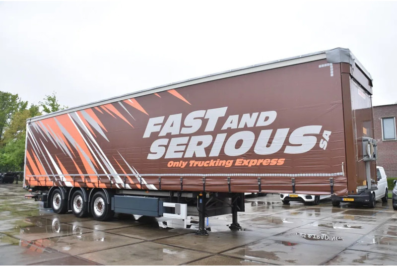 Fruehauf SLIDING CURTAINS/ROOF - TOPLIFT SYSTEM - LIFT AXLE - STEERING AXLE - SAF AXLES - ALCOA'S - DHOLLANDIA - TOP CONDITION - - Semirremolque lona: foto 1 Fruehauf SLIDING CURTAINS/ROOF - TOPLIFT SYSTEM - LIFT AXLE - STEERING AXLE - SAF AXLES - ALCOA'S - DHOLLANDIA - TOP CONDITION - - Semirremolque lona: foto 1