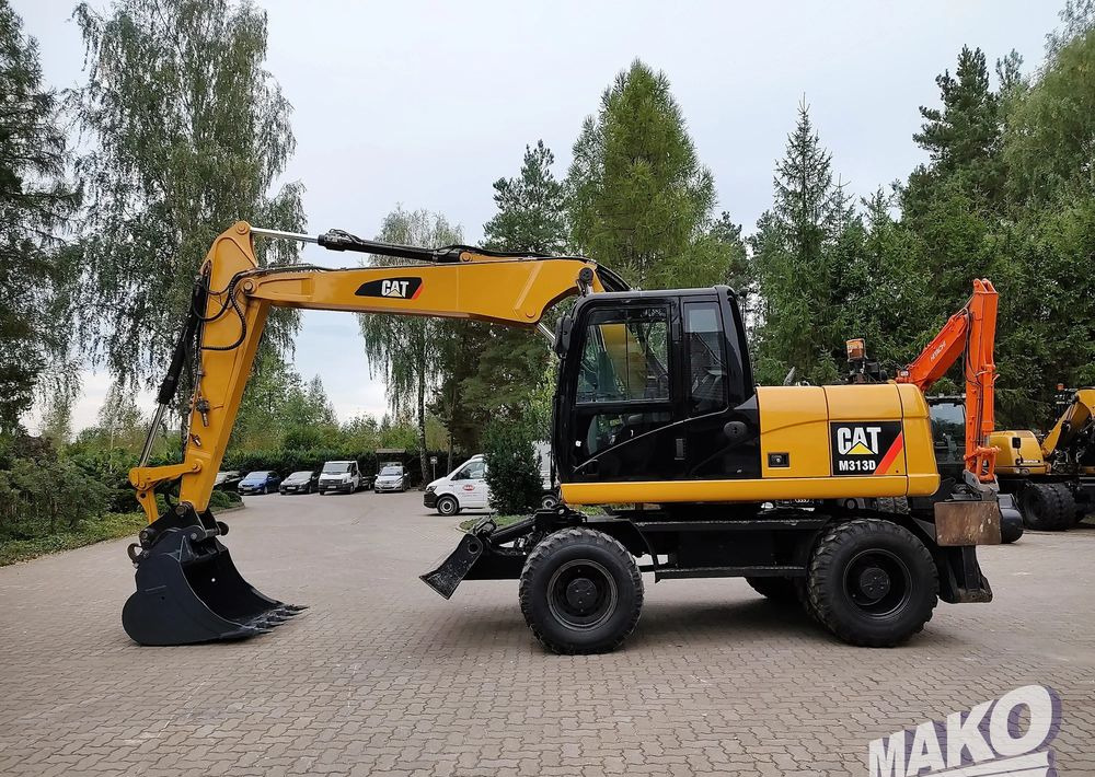 Caterpillar M313D - Excavadora de ruedas: foto 1 Caterpillar M313D - Excavadora de ruedas: foto 1