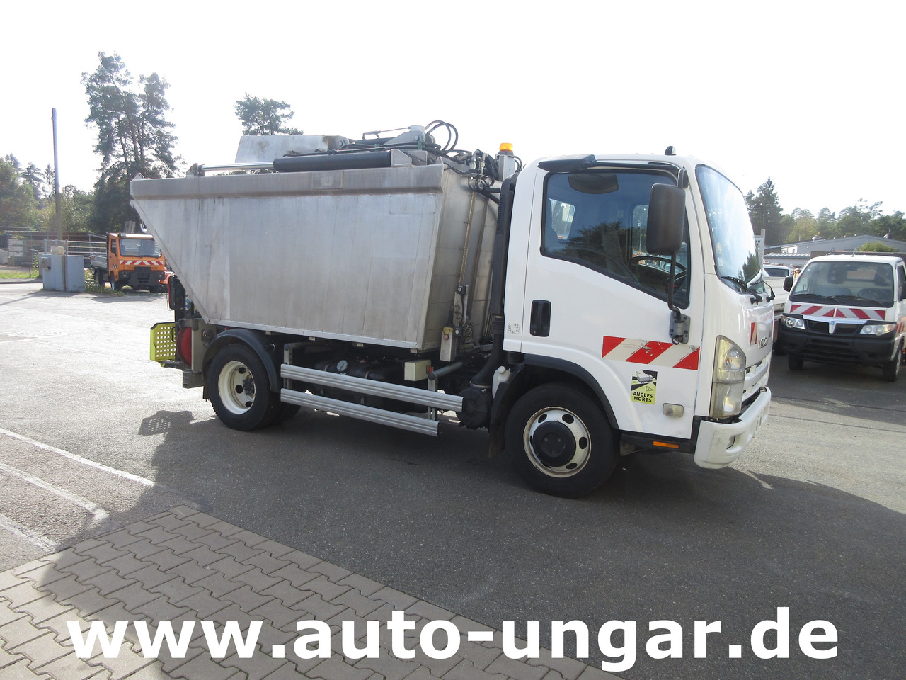Isuzu NPR 75 Müllwagen Provence Benne - Faun Lifter Presse Kipper Trittbrett Bj 12 - Camión de basura: foto 1 Isuzu NPR 75 Müllwagen Provence Benne - Faun Lifter Presse Kipper Trittbrett Bj 12 - Camión de basura: foto 1