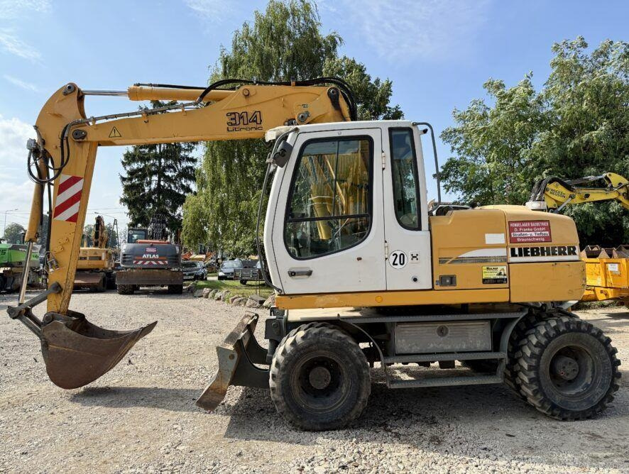 Liebherr A314 - Excavadora de ruedas: foto 1 Liebherr A314 - Excavadora de ruedas: foto 1