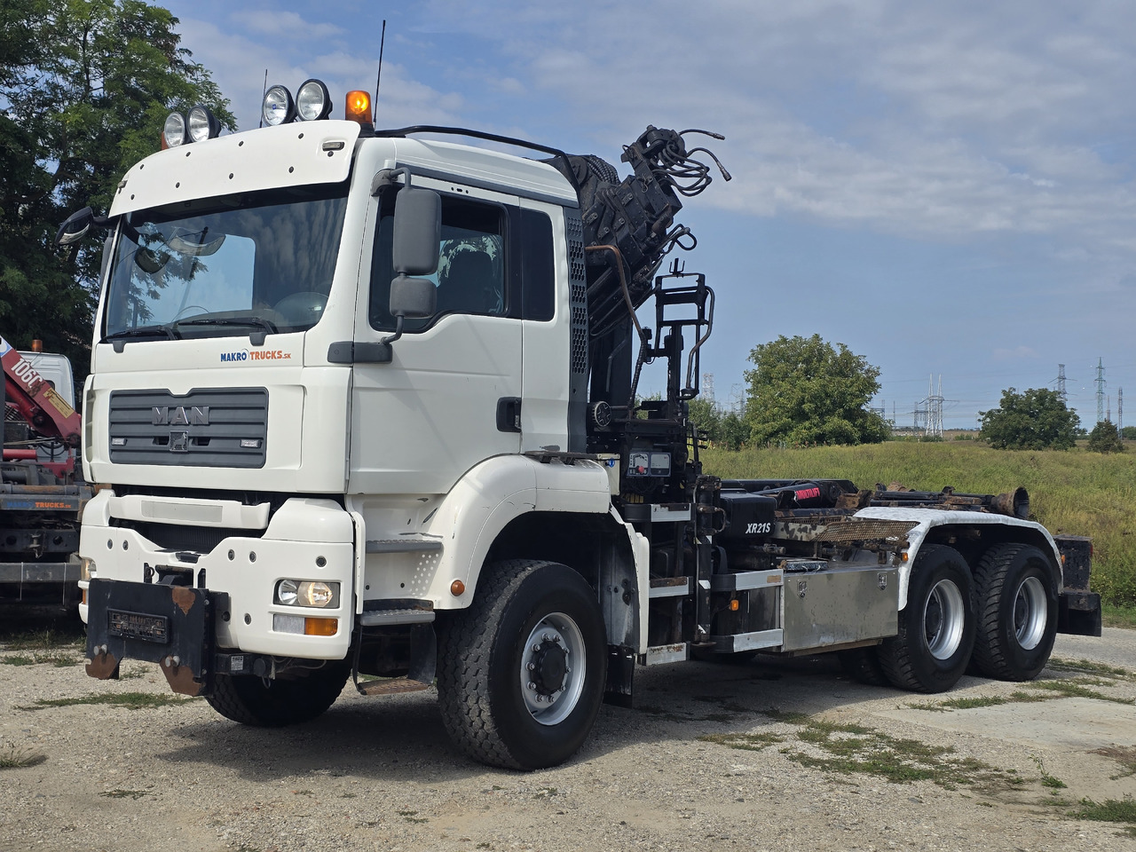 MAN TGA 26.440 6X6 / HOOK SYSTEM / HIAB 166D REMOTE - Camión multibasculante, Camión grúa: foto 1 MAN TGA 26.440 6X6 / HOOK SYSTEM / HIAB 166D REMOTE - Camión multibasculante, Camión grúa: foto 1