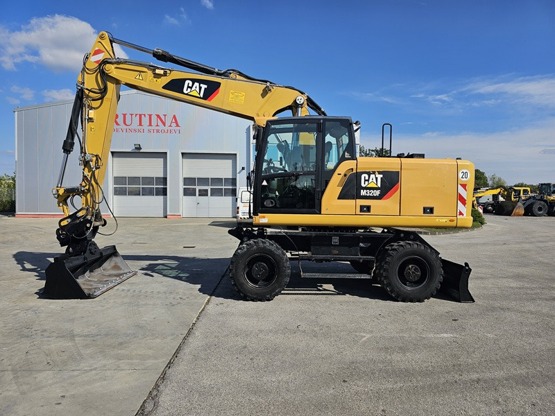 CATERPILLAR M320F - Excavadora de ruedas: foto 1 CATERPILLAR M320F - Excavadora de ruedas: foto 1