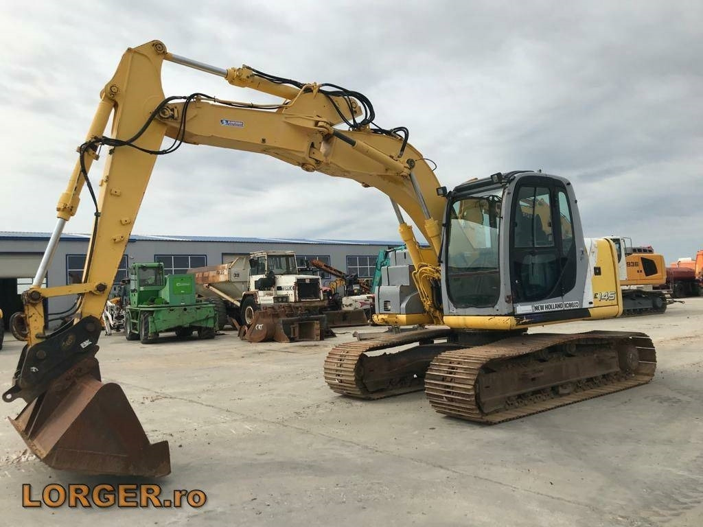 New Holland E 145 - Excavadora de cadenas: foto 1 New Holland E 145 - Excavadora de cadenas: foto 1