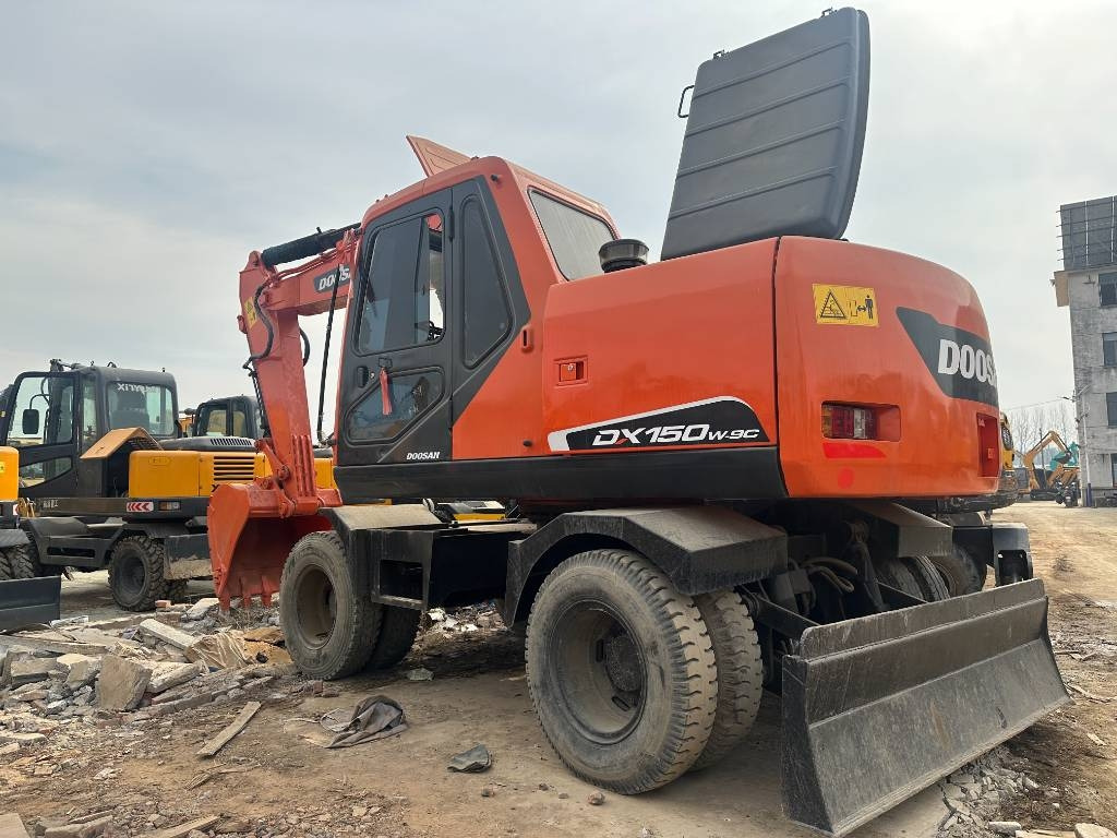 Doosan DX 150W -9 - Excavadora de ruedas: foto 1 Doosan DX 150W -9 - Excavadora de ruedas: foto 1