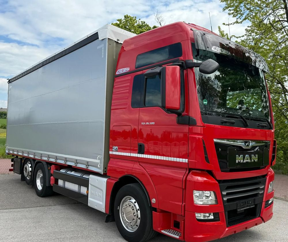 MAN TGX 26.500/LIFT/6X2/KLIMA POSTOJOWA/18PALET/E6/FIRANKA/WINDA/NISKI PRZEBIEG/JEDEN WŁAŚCICIEL/PODWIESZANA OŚ - Camión lona: foto 1 MAN TGX 26.500/LIFT/6X2/KLIMA POSTOJOWA/18PALET/E6/FIRANKA/WINDA/NISKI PRZEBIEG/JEDEN WŁAŚCICIEL/PODWIESZANA OŚ - Camión lona: foto 1