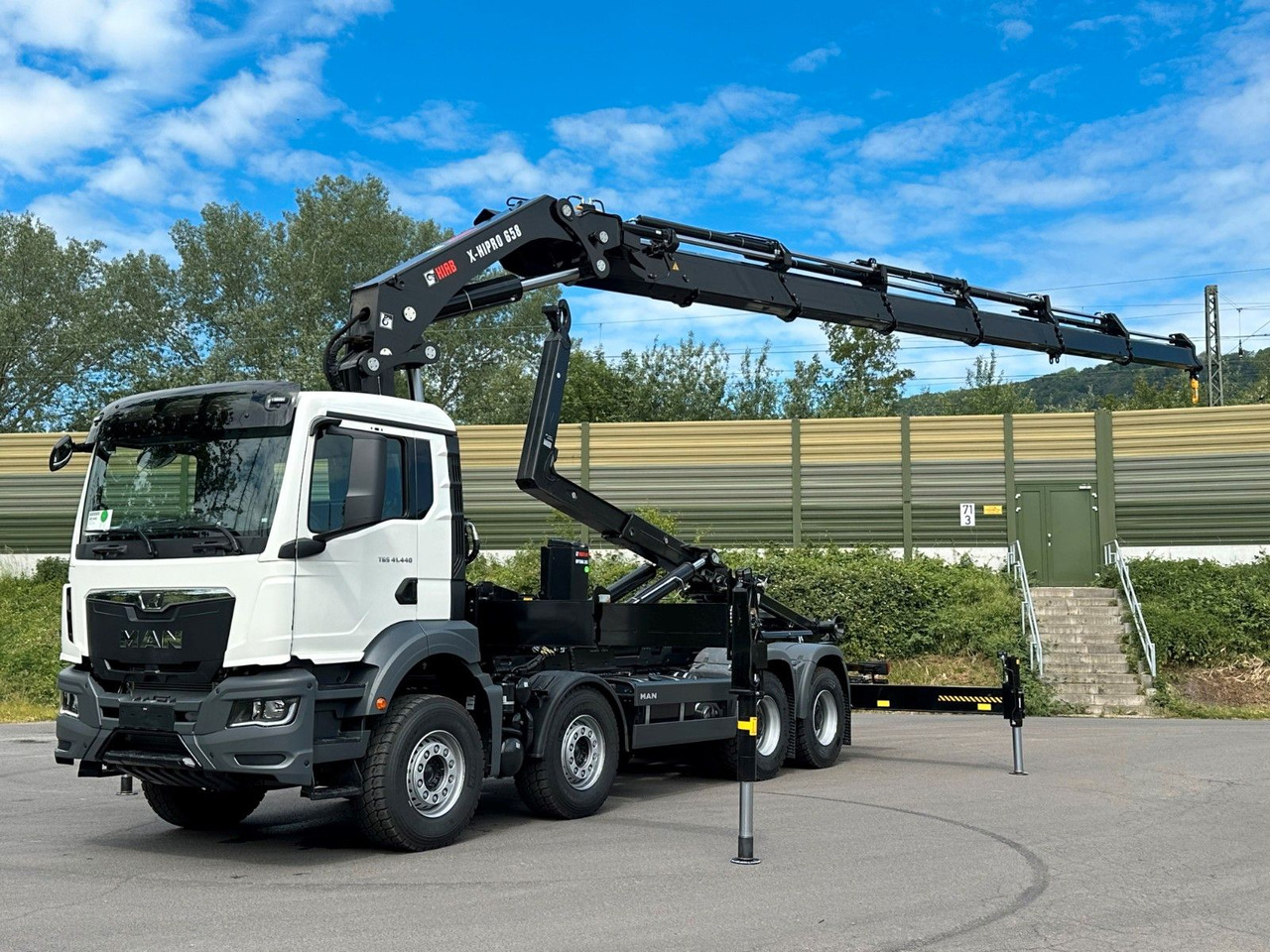 MAN TGS 35.520 8x4 Abrollkipper + Kran HIAB 658E6 - Camión multibasculante, Camión grúa: foto 1 MAN TGS 35.520 8x4 Abrollkipper + Kran HIAB 658E6 - Camión multibasculante, Camión grúa: foto 1
