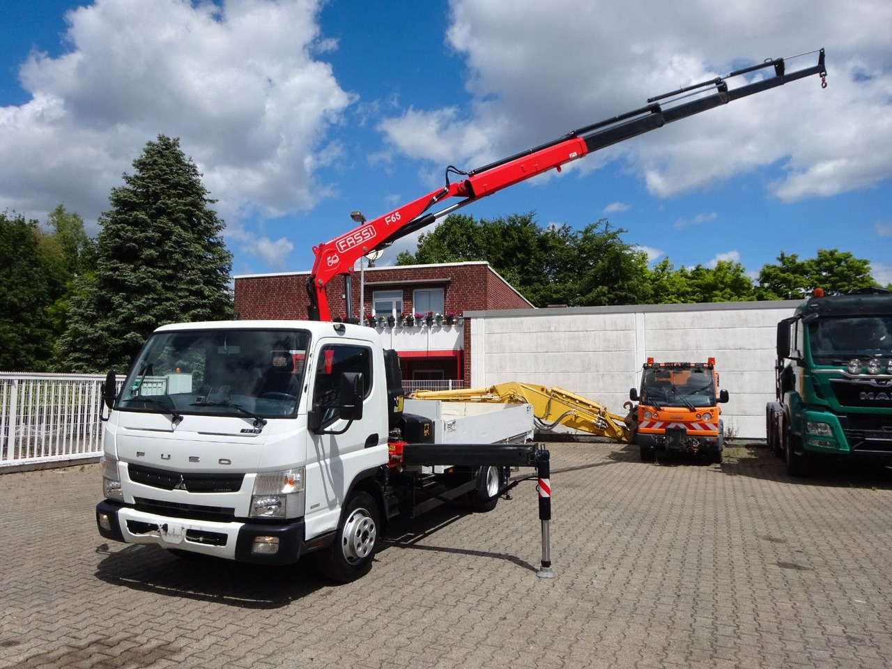 FUSO Canter 7C15 mit FASSI F65A Kran - Camión grúa, Camión caja abierta: foto 5 FUSO Canter 7C15 mit FASSI F65A Kran - Camión grúa, Camión caja abierta: foto 5
