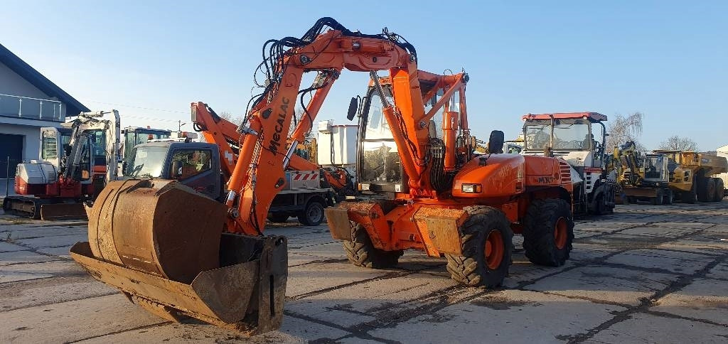 Mecalac 12 M TX - Excavadora de ruedas: foto 1 Mecalac 12 M TX - Excavadora de ruedas: foto 1