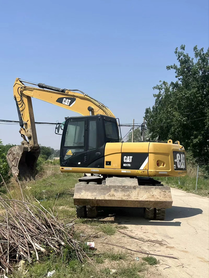 CATERPILLAR M317D2 - Excavadora de ruedas: foto 4 CATERPILLAR M317D2 - Excavadora de ruedas: foto 4