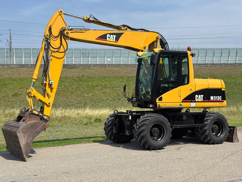 Caterpillar M313C - Excavadora de ruedas: foto 1 Caterpillar M313C - Excavadora de ruedas: foto 1