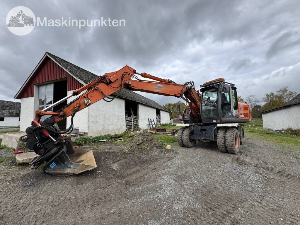 Hitachi ZX 140 W-3 - Excavadora de ruedas: foto 1 Hitachi ZX 140 W-3 - Excavadora de ruedas: foto 1