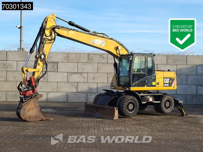 Caterpillar M315 D OUTRIGGERS + BLADE - Excavadora de ruedas: foto 1 Caterpillar M315 D OUTRIGGERS + BLADE - Excavadora de ruedas: foto 1