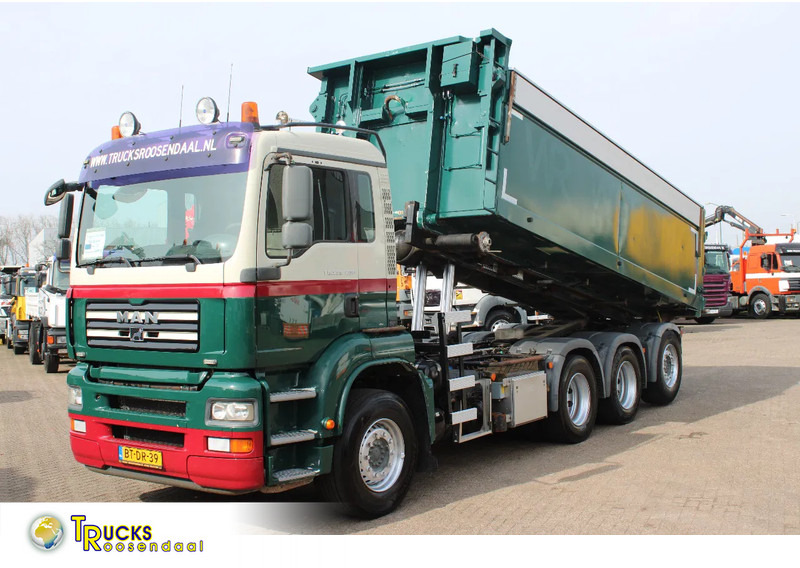 MAN TGA 35.400 8X4 + MANUAL! + NCH kipper/ bitum sprayer - Camión con equipo de cable: foto 1 MAN TGA 35.400 8X4 + MANUAL! + NCH kipper/ bitum sprayer - Camión con equipo de cable: foto 1