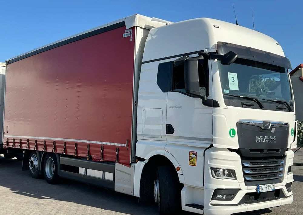 MAN TGX 26.470 z przyczepą Redos - Camión lona: foto 3 MAN TGX 26.470 z przyczepą Redos - Camión lona: foto 3