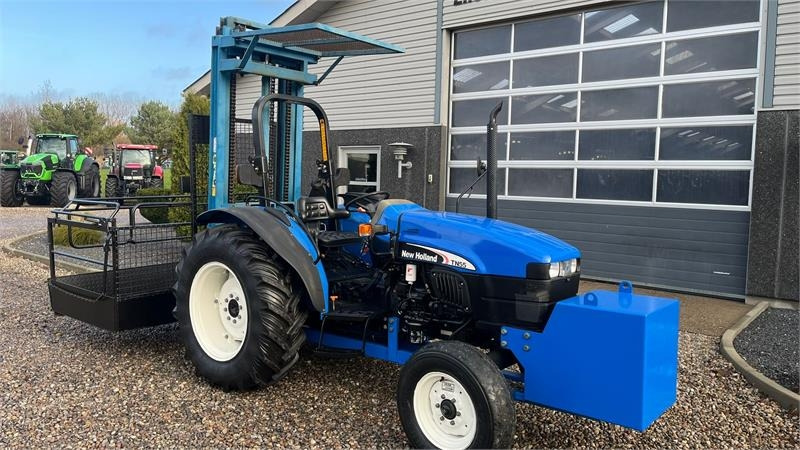 Tractor New Holland TN55D Med Byggelift: foto 15 Tractor New Holland TN55D Med Byggelift: foto 15