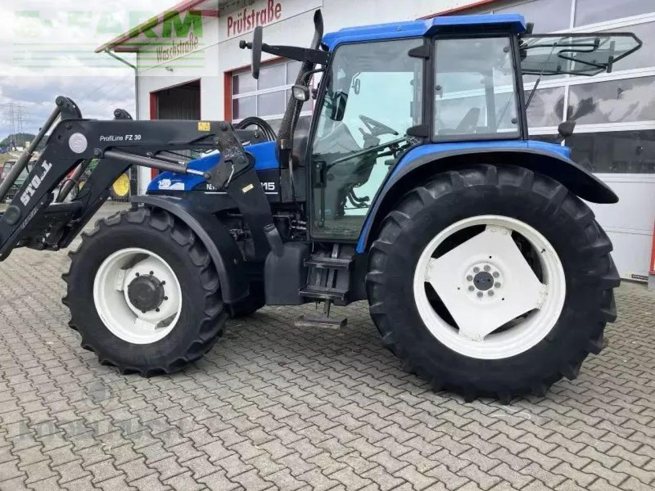 New Holland ts 115 - Tractor: foto 1 New Holland ts 115 - Tractor: foto 1