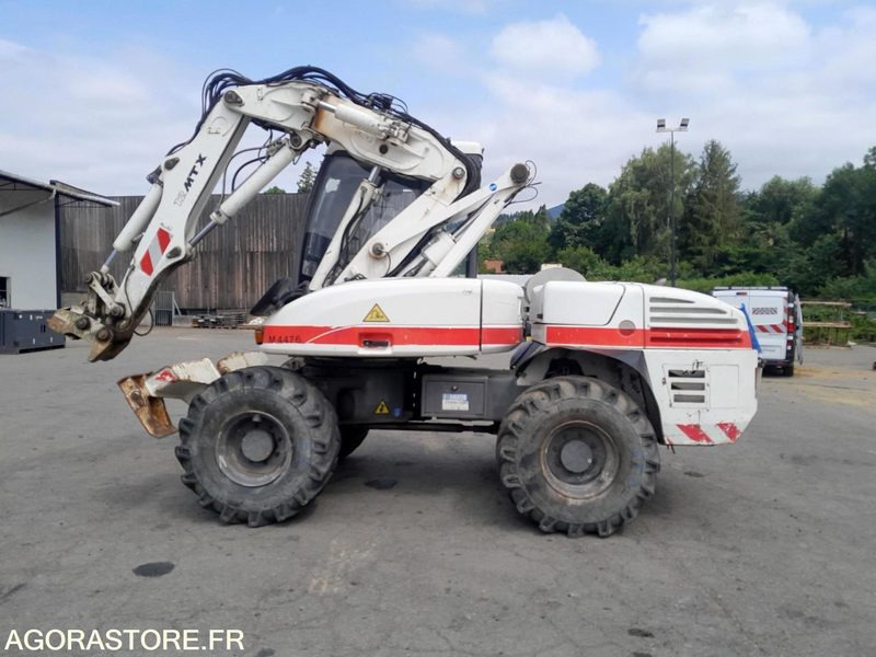 PELLE SUR PNEUS - MECALAC - 12 MTX - 2012 / 11451 HEURES (M4476) - Excavadora: foto 1 PELLE SUR PNEUS - MECALAC - 12 MTX - 2012 / 11451 HEURES (M4476) - Excavadora: foto 1