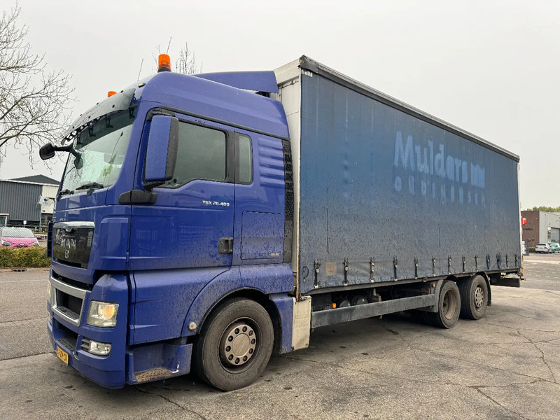 MAN TGX 26.400 6X2 - EURO 4 + LIFT + STEERING AXLE + TÜV 10-2025 - Camión lona: foto 1 MAN TGX 26.400 6X2 - EURO 4 + LIFT + STEERING AXLE + TÜV 10-2025 - Camión lona: foto 1