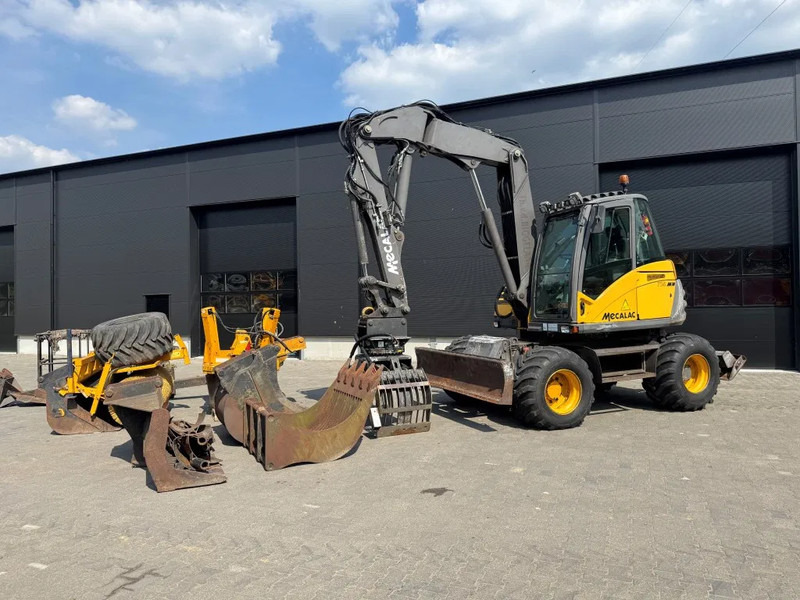 Mecalac 714MW FULL ATTACHMENTS OVERCOMPLEET !!! - Excavadora de ruedas: foto 2 Mecalac 714MW FULL ATTACHMENTS OVERCOMPLEET !!! - Excavadora de ruedas: foto 2