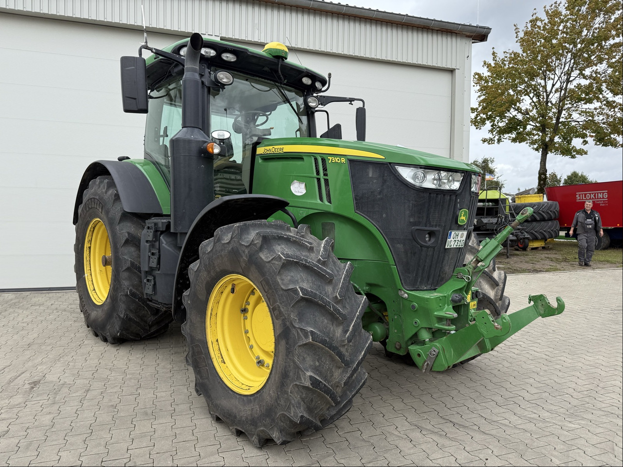 John Deere 7310R E23 - Tractor: foto 1 John Deere 7310R E23 - Tractor: foto 1